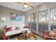 Bright sunroom features a scenic view of the outdoors and comfortable seating at 321 108Th W St # 120, Bradenton, FL 34209