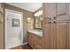 Stylish bathroom with wood cabinets, granite countertop and decorative artwork at 321 108Th W St # 120, Bradenton, FL 34209