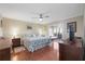 Bright bedroom with stylish decor, hardwood floors and access to an outdoor balcony at 321 108Th W St # 120, Bradenton, FL 34209