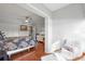 Relaxing bedroom featuring hardwood floors, ceiling fan, and a cozy sitting area by the window at 321 108Th W St # 120, Bradenton, FL 34209