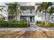Charming condo exterior featuring a well-manicured garden, balcony and a welcoming entrance at 321 108Th W St # 120, Bradenton, FL 34209