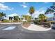 Charming villa complex with tropical landscaping, awnings, and convenient parking at 321 108Th W St # 120, Bradenton, FL 34209