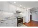 Bright kitchen with granite countertops, white cabinets and updated appliances at 321 108Th W St # 120, Bradenton, FL 34209