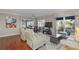 Bright living room featuring wood floors, ceiling fan, and a view of the water at 321 108Th W St # 120, Bradenton, FL 34209