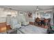 Inviting living room featuring a stylish rug, ceiling fan, and easy access to the kitchen and dining area at 321 108Th W St # 120, Bradenton, FL 34209