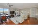 Cozy living room with hardwood floors, ceiling fan, and view of the lake at 321 108Th W St # 120, Bradenton, FL 34209