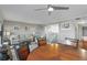 Open concept living and dining area, bright with ceiling fan and wood flooring at 321 108Th W St # 120, Bradenton, FL 34209