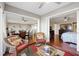 Inviting living room with open layout showcasing hardwood floors and multiple seating areas at 321 108Th W St # 120, Bradenton, FL 34209
