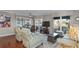 Inviting living room boasts water views, ceiling fan, and wood floors at 321 108Th W St # 120, Bradenton, FL 34209