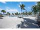 Resort-style community pool with palm trees, lounge chairs, and ample deck space at 321 108Th W St # 120, Bradenton, FL 34209