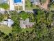Aerial view showing home nestled among mature trees in quiet area at 325 12Th W Ave, Palmetto, FL 34221