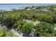 Aerial view of lush landscaping offering peaceful privacy by the bay at 325 12Th W Ave, Palmetto, FL 34221