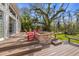 Outdoor deck with fire pit and beautiful landscaping at 325 12Th W Ave, Palmetto, FL 34221