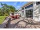 Spacious backyard with a wooden deck, and mature trees at 325 12Th W Ave, Palmetto, FL 34221