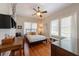 Bedroom features hardwood floors, ceiling fan and windows offering plenty of natural light at 325 12Th W Ave, Palmetto, FL 34221