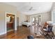 A spacious bedroom featuring hardwood floors, high ceilings, and a view of the outdoor patio at 325 12Th W Ave, Palmetto, FL 34221