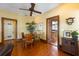 Dining room featuring hardwood floors, decorative trim, a plant, and vintage furnishings at 325 12Th W Ave, Palmetto, FL 34221
