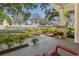 Inviting front porch view showcasing neighborhood charm and lush landscaping at 325 12Th W Ave, Palmetto, FL 34221
