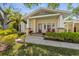 Inviting front porch of home featuring ample space and lush landscaping at 325 12Th W Ave, Palmetto, FL 34221