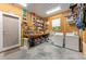 Inside of garage featuring tools, storage cabinets, and washer/dryer at 325 12Th W Ave, Palmetto, FL 34221