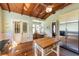 Charming kitchen boasts wood floors, vaulted wood ceilings, and stainless steel appliances at 325 12Th W Ave, Palmetto, FL 34221