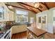 Beautiful kitchen with white cabinets, tiled backsplash, stainless steel appliances, and a unique wood ceiling at 325 12Th W Ave, Palmetto, FL 34221
