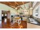 Bright, open kitchen features wood floors, stainless steel appliances, and colorful backsplash at 325 12Th W Ave, Palmetto, FL 34221