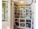 Spacious pantry offers ample shelving and storage space behind glass door at 325 12Th W Ave, Palmetto, FL 34221