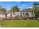 Charming home with a large wooden deck perfect for entertaining at 325 12Th W Ave, Palmetto, FL 34221
