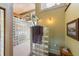 Bright bathroom with shower stall enclosed with glass blocks and small seating area at 325 12Th W Ave, Palmetto, FL 34221