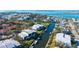 Aerial view of waterfront condos with boat docks along the canal in a neighborhood at 4104 128Th W St # 704, Cortez, FL 34215