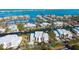 Beautiful aerial view of condos, canals, and a harbor, providing waterfront living at 4104 128Th W St # 704, Cortez, FL 34215