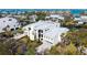 An elevated view showcases the property with ample parking and lush landscaping at 4104 128Th W St # 704, Cortez, FL 34215