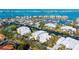 Stunning aerial view of waterfront condos with boat docks, overlooking the bay and harbor at 4104 128Th W St # 704, Cortez, FL 34215