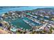 Stunning aerial view showcasing waterfront condos, boat docks, and marina at 4104 128Th W St # 704, Cortez, FL 34215
