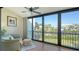 Enclosed lanai featuring sliding glass doors with views of waterfront community at 4104 128Th W St # 704, Cortez, FL 34215