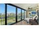 Enclosed lanai featuring sliding glass doors with views of waterfront community at 4104 128Th W St # 704, Cortez, FL 34215