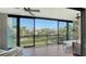 Enclosed lanai featuring sliding glass doors with views of waterfront community at 4104 128Th W St # 704, Cortez, FL 34215