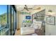 Enclosed lanai featuring sliding glass doors with views of waterfront community at 4104 128Th W St # 704, Cortez, FL 34215