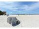 Wide sandy beach area with recreational beach volleyball, a lifeguard tower, and an elephant-themed playground at 4104 128Th W St # 704, Cortez, FL 34215