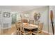 Cozy dining room with a wooden table and seating for six at 4104 128Th W St # 704, Cortez, FL 34215