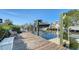 Wooden dock with boat lift showcases waterfront living and access for boating enthusiasts, offering tranquil views at 4104 128Th W St # 704, Cortez, FL 34215