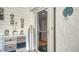 Front entryway with coastal decor and a surfboard at 4104 128Th W St # 704, Cortez, FL 34215