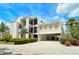 Attractive condo complex with covered parking, well-manicured landscaping, and a welcoming facade at 4104 128Th W St # 704, Cortez, FL 34215