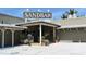 Exterior of the Sandbar Restaurant, showing the entrance and surrounding landscaping at 4104 128Th W St # 704, Cortez, FL 34215