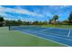 Outdoor tennis court with blue and green surface, perfect for sports enthusiasts at 4104 128Th W St # 704, Cortez, FL 34215