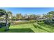 Waterfront condos with boat docks and manicured lawns offer a serene living experience in a tropical setting at 4104 128Th W St # 704, Cortez, FL 34215