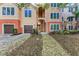 Two-story condo with garages and an exterior staircase at 4110 Central Sarasota Pkwy # 123, Sarasota, FL 34238