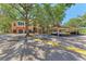Condo exterior featuring parking spots and a covered parking area at 4110 Central Sarasota Pkwy # 123, Sarasota, FL 34238