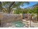 Peaceful spa area with a hot tub featuring decorative stone accents, providing an oasis of relaxation at 4110 Central Sarasota Pkwy # 123, Sarasota, FL 34238